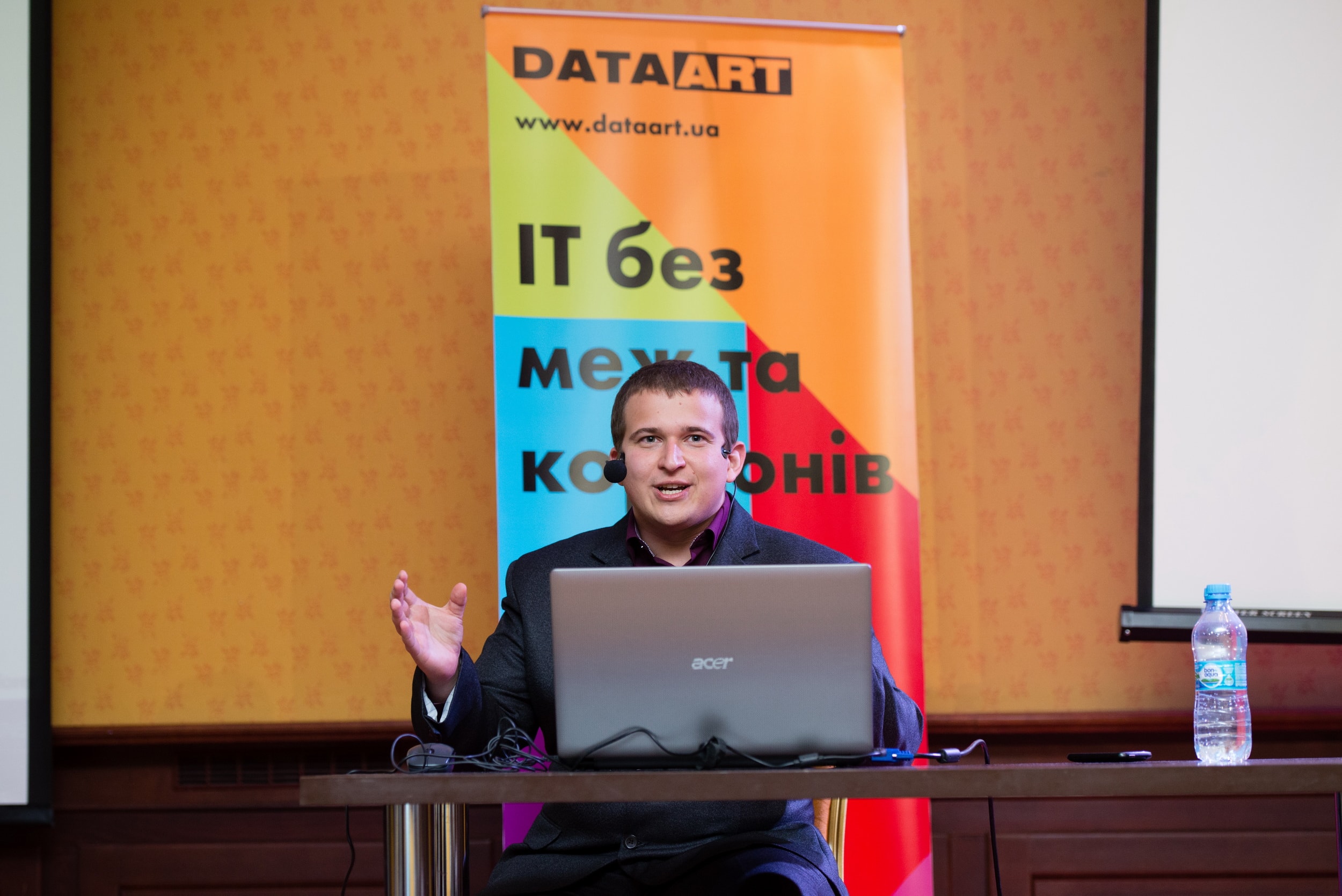 The speaker, Syrovatchenko Sergey, is delivering information at the conference